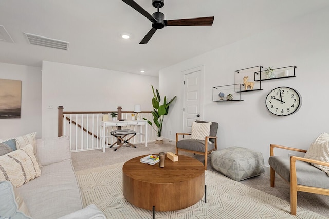 carpeted living area featuring visible vents, recessed lighting, baseboards, and ceiling fan