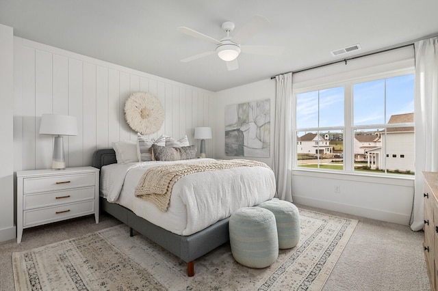 bedroom with light colored carpet and ceiling fan