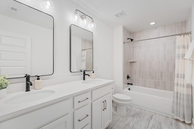 full bathroom featuring a sink, visible vents, shower / bath combo, and double vanity