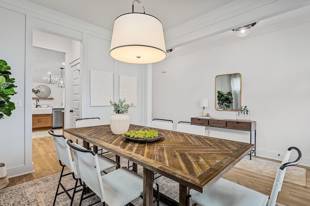 dining space featuring light wood-type flooring