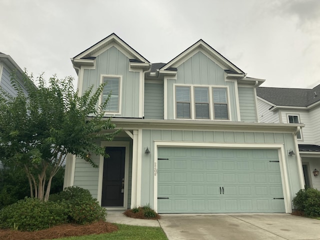 2208 Primus Rd, Mount Pleasant, SC 29466 - view of front of house featuring board and batten siding, concrete driveway, and an attached garage