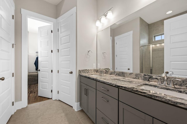 2208 Primus Rd, Mount Pleasant, SC 29466 - bathroom with a stall shower, double vanity, baseboards, and recessed lighting