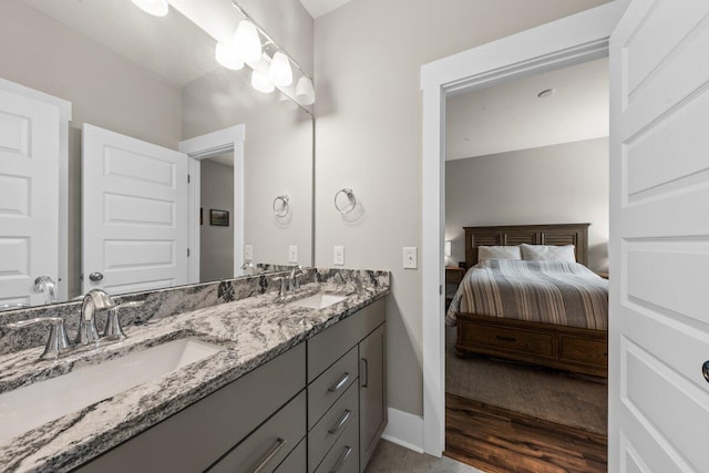 2208 Primus Rd, Mount Pleasant, SC 29466 - ensuite bathroom featuring double vanity, baseboards, and wood finished floors