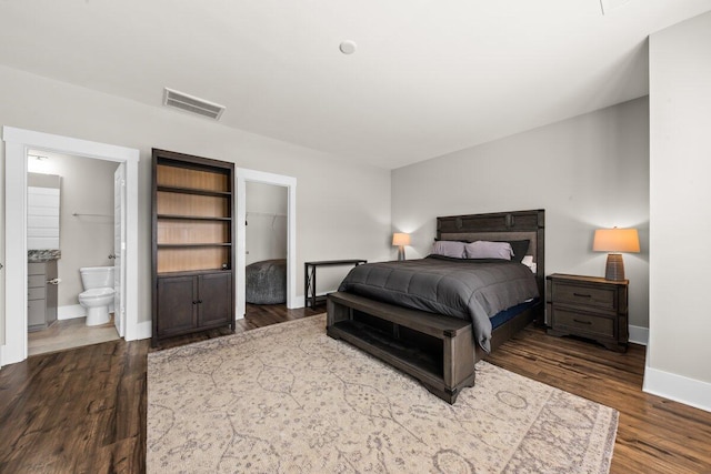 2208 Primus Rd, Mount Pleasant, SC 29466 - bedroom featuring wood finished floors, baseboards, connected bathroom, and a spacious closet
