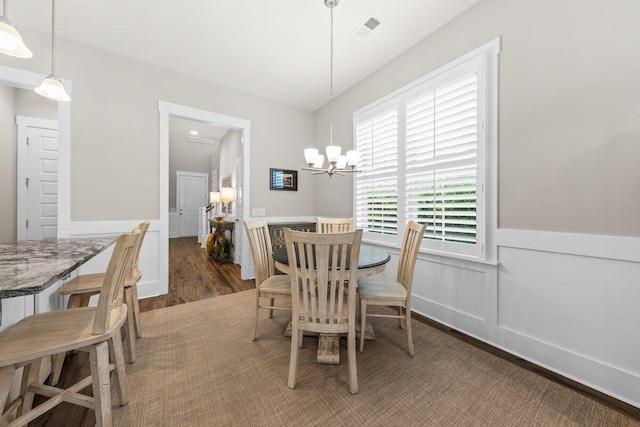 2208 Primus Rd, Mount Pleasant, SC 29466 - dining space with wood finished floors, a chandelier, and wainscoting
