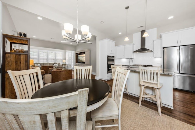 2208 Primus Rd, Mount Pleasant, SC 29466 - dining area with a chandelier, wood finished floors, and recessed lighting
