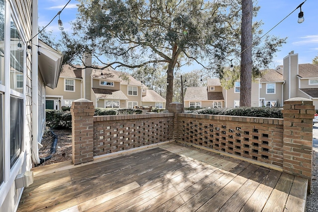 wooden terrace featuring a residential view