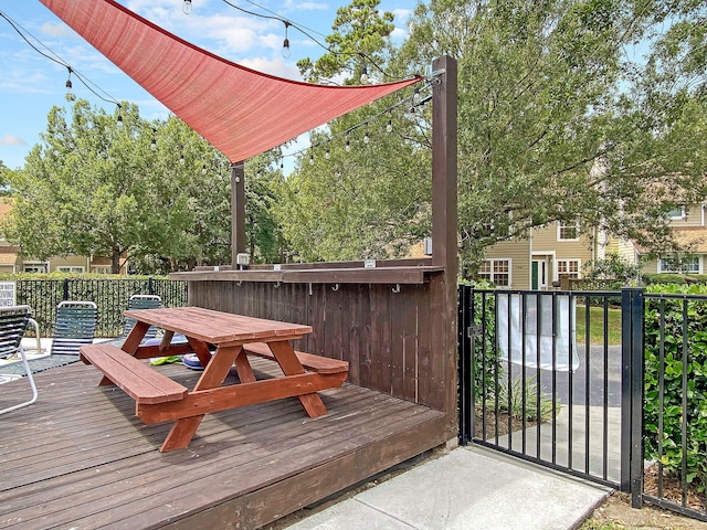 wooden deck featuring outdoor dining space