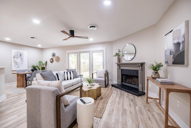 1161 Monaco Dr, Mount Pleasant, SC 29464 - living room featuring ceiling fan, a fireplace with raised hearth, light wood finished floors, and recessed lighting