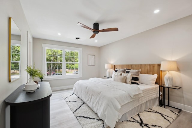 1161 Monaco Dr, Mount Pleasant, SC 29464 - bedroom with multiple windows, light wood-style floors, recessed lighting, and a ceiling fan
