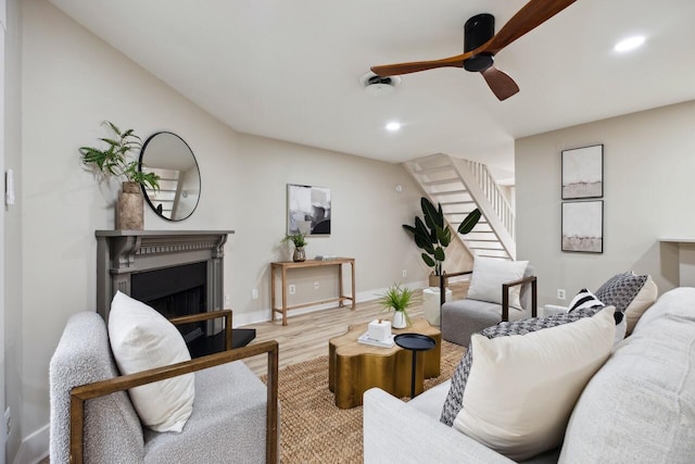 1161 Monaco Dr, Mount Pleasant, SC 29464 - living room with wood finished floors, stairs, recessed lighting, a ceiling fan, and a fireplace with raised hearth