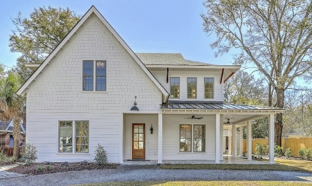 755 Adluh St, Mount Pleasant, SC 29464 - rear view of house featuring ceiling fan, fence, a standing seam roof, a shingled roof, and metal roof