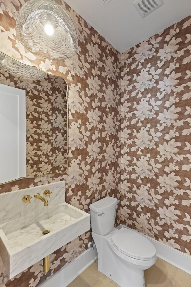 755 Adluh St, Mount Pleasant, SC 29464 - bathroom with visible vents, baseboards, toilet, and wallpapered walls
