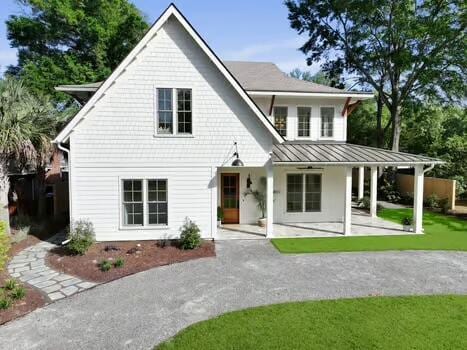 755 Adluh St, Mount Pleasant, SC 29464 - rear view of property with a yard, a patio, a standing seam roof, and metal roof