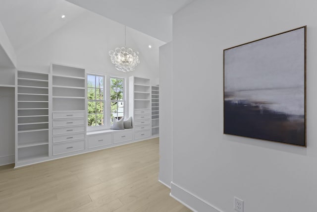 755 Adluh St, Mount Pleasant, SC 29464 - interior space with built in shelves, high vaulted ceiling, light wood finished floors, a notable chandelier, and recessed lighting