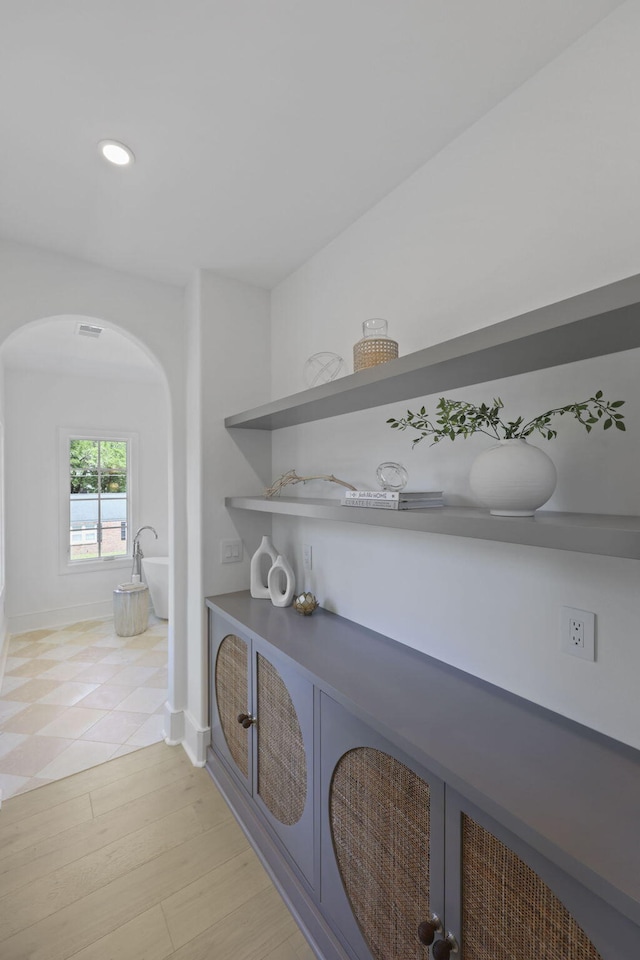 755 Adluh St, Mount Pleasant, SC 29464 - hall with visible vents, arched walkways, baseboards, recessed lighting, and light wood-style flooring