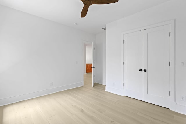 755 Adluh St, Mount Pleasant, SC 29464 - unfurnished bedroom with light wood-style floors, baseboards, ceiling fan, and a closet