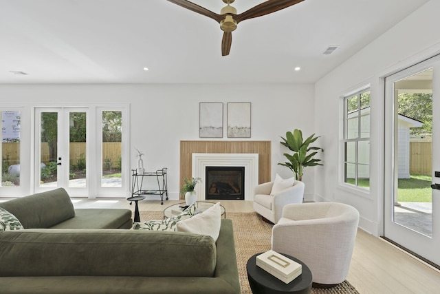 755 Adluh St, Mount Pleasant, SC 29464 - living room with a ceiling fan, visible vents, light wood finished floors, and a fireplace
