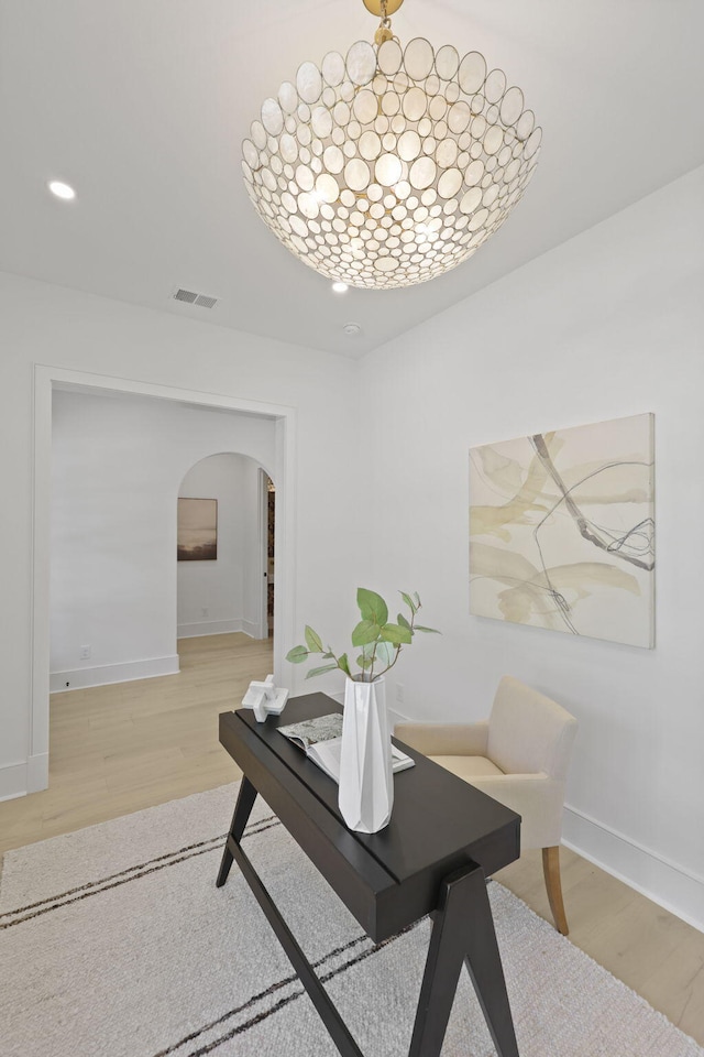 755 Adluh St, Mount Pleasant, SC 29464 - dining room featuring arched walkways, baseboards, visible vents, and light wood-style floors