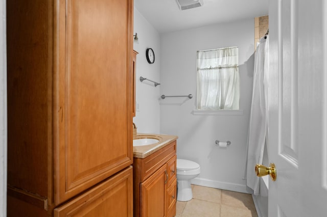 bathroom featuring vanity, tile patterned flooring, toilet, and curtained shower