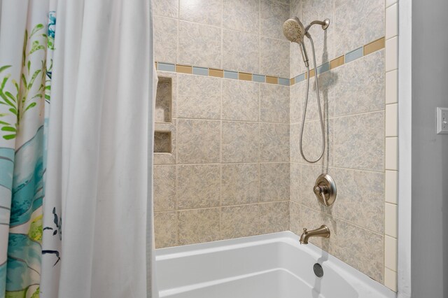 bathroom with shower / bathtub combination with curtain