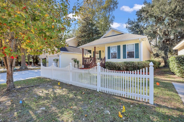 view of front of home with covered porch and a front yard