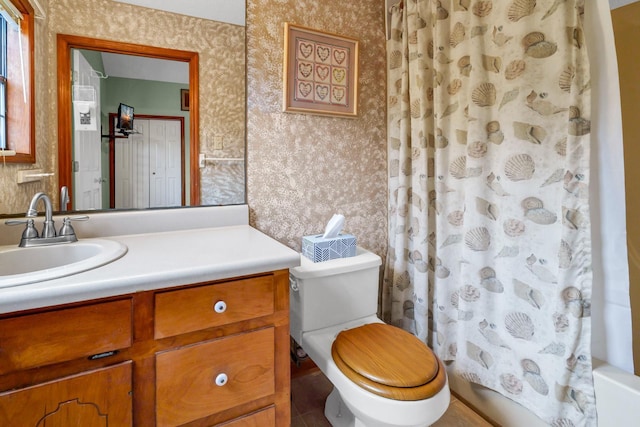 209 Jungle Rd, Edisto Beach, SC 29438 - full bath featuring wallpapered walls, toilet, vanity, shower / tub combo, and tile patterned flooring