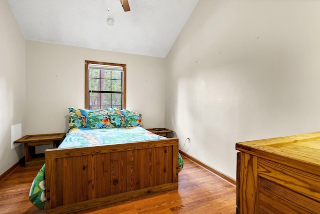 209 Jungle Rd, Edisto Beach, SC 29438 - bedroom with vaulted ceiling, wood finished floors, baseboards, and ceiling fan