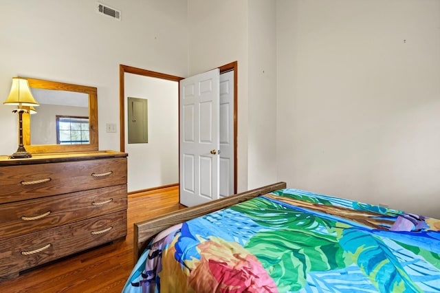 209 Jungle Rd, Edisto Beach, SC 29438 - bedroom featuring wood finished floors and a high ceiling