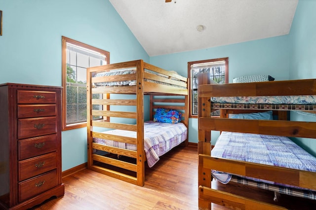 209 Jungle Rd, Edisto Beach, SC 29438 - bedroom featuring vaulted ceiling and wood finished floors