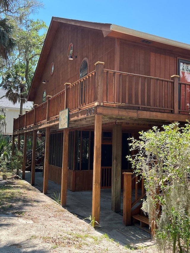 209 Jungle Rd, Edisto Beach, SC 29438 - rear view of property with a deck and stairway