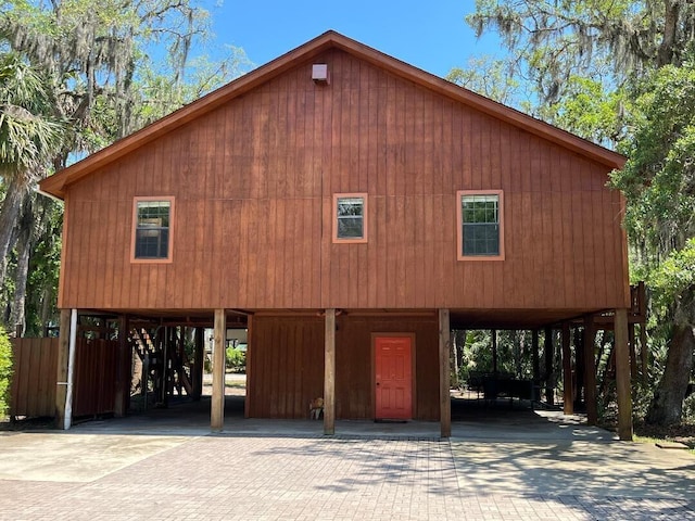 209 Jungle Rd, Edisto Beach, SC 29438 - view of front facade featuring a carport and driveway