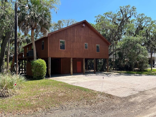 209 Jungle Rd, Edisto Beach, SC 29438 - view of side of home featuring driveway