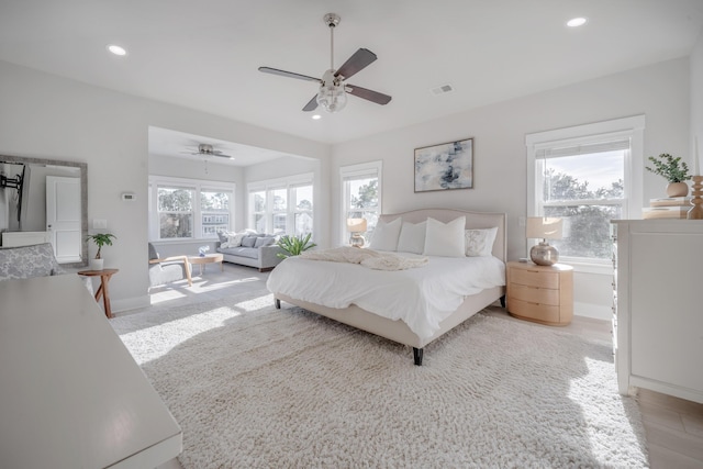 bedroom featuring baseboards, visible vents, and recessed lighting