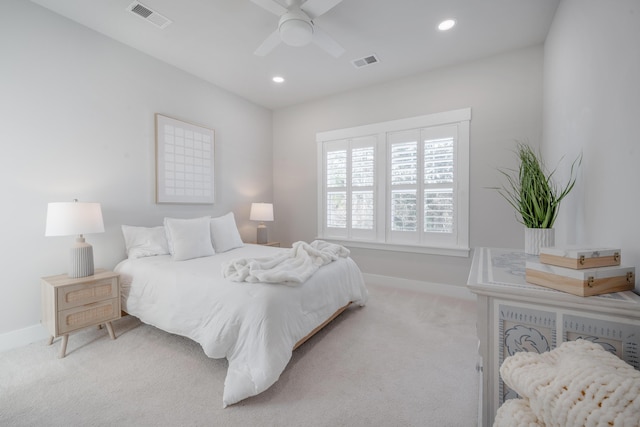carpeted bedroom featuring recessed lighting, visible vents, and baseboards