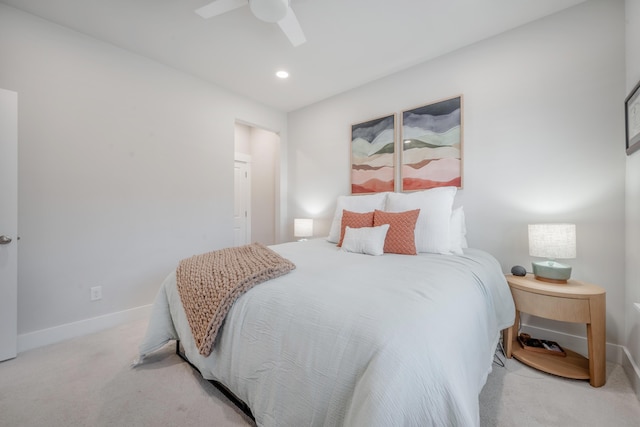 bedroom with recessed lighting, ceiling fan, baseboards, and light carpet