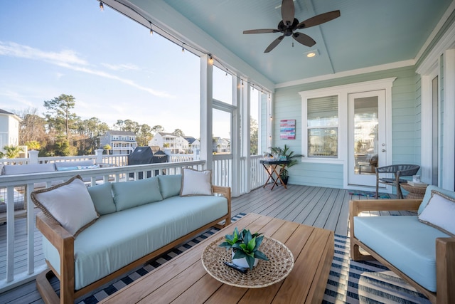 sunroom / solarium with a ceiling fan and outdoor lounge area