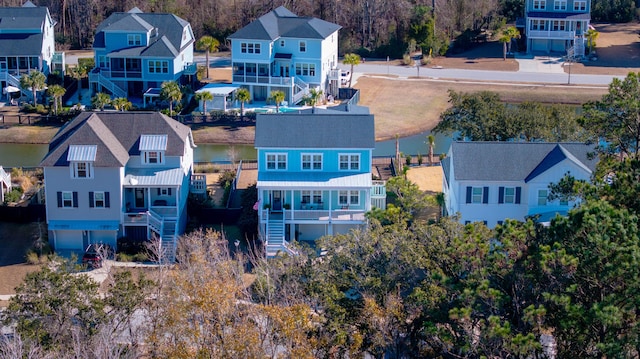 aerial view with a residential view and a water view