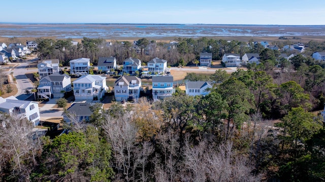 birds eye view of property with a residential view