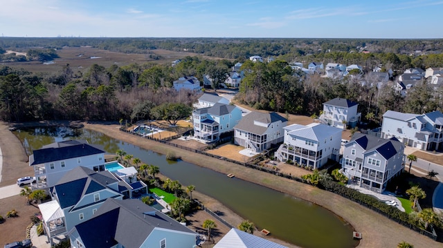 drone / aerial view featuring a residential view and a water view