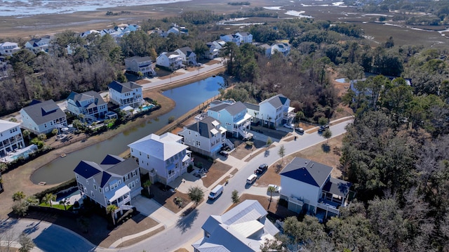 bird's eye view featuring a water view and a residential view