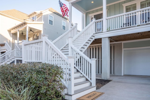 exterior space with driveway, stairs, and a garage