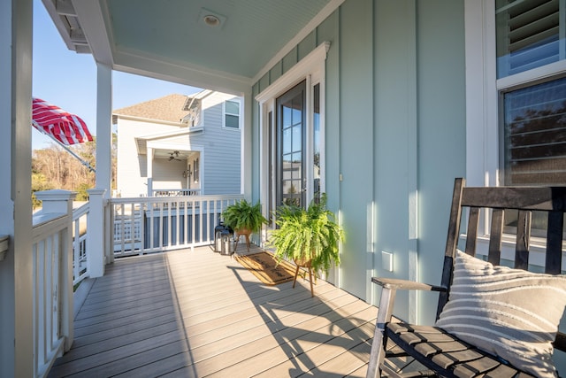 wooden terrace with a porch