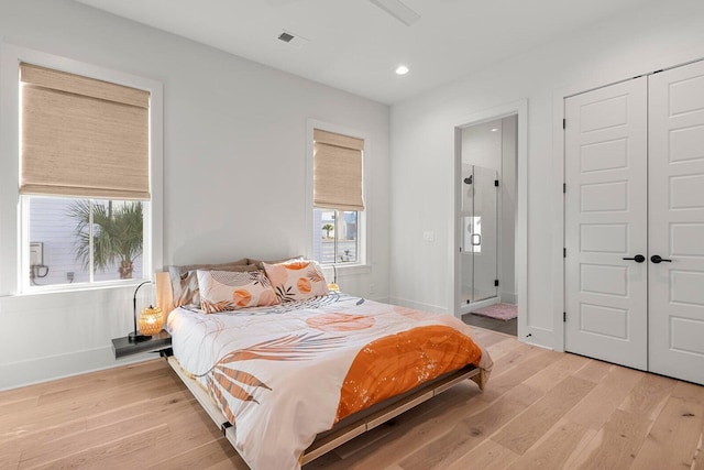 bedroom with visible vents, baseboards, light wood-type flooring, recessed lighting, and a closet