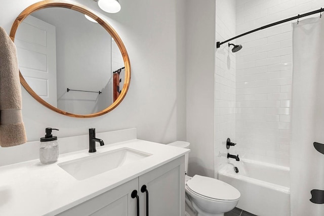 bathroom with vanity, shower / tub combo, and toilet