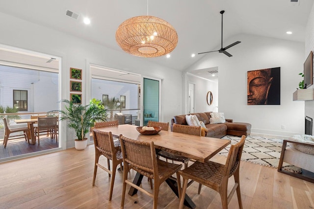 dining space with visible vents, a ceiling fan, recessed lighting, light wood-style floors, and a fireplace