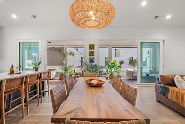 dining room featuring recessed lighting, visible vents, and light wood-type flooring