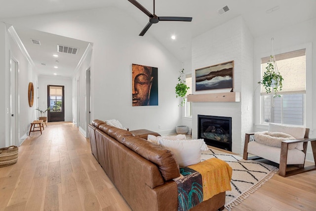 living room featuring light wood-style flooring and visible vents