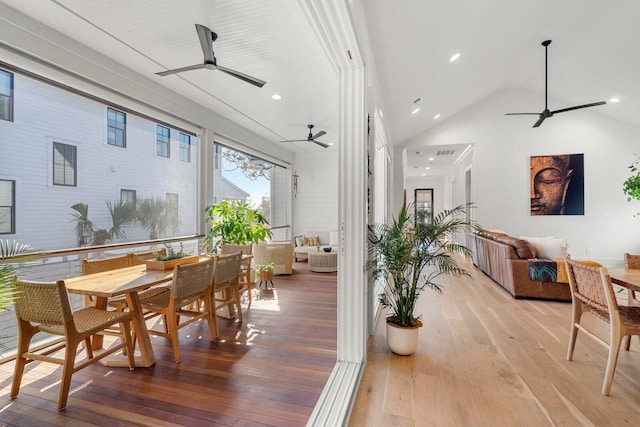 interior space featuring light wood finished floors, recessed lighting, high vaulted ceiling, and a ceiling fan