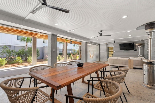 dining room with recessed lighting, a ceiling fan, and concrete flooring